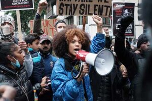 Young activist speaking into megaphone